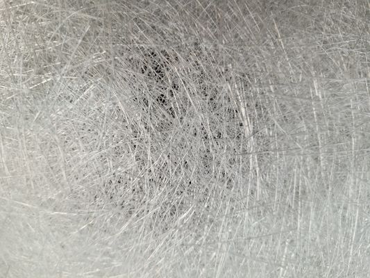 Alors que la surface lisse du tissu unidirectionnel en verre ECR